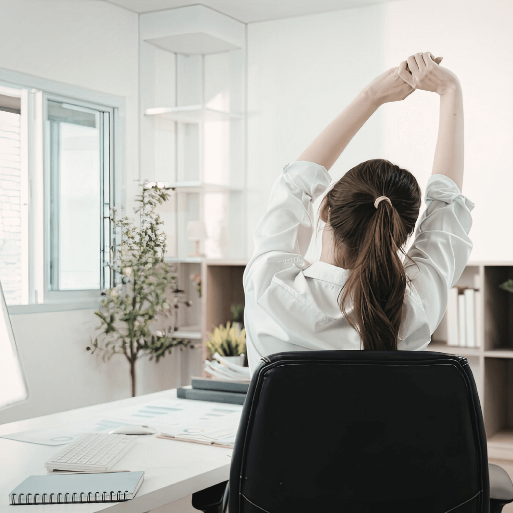Women Stretching at her Desk. Workplace Corporate Pilates Dublin
