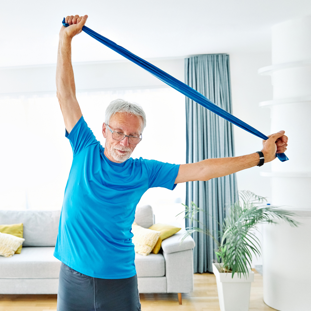 senior man stretching with a theraband