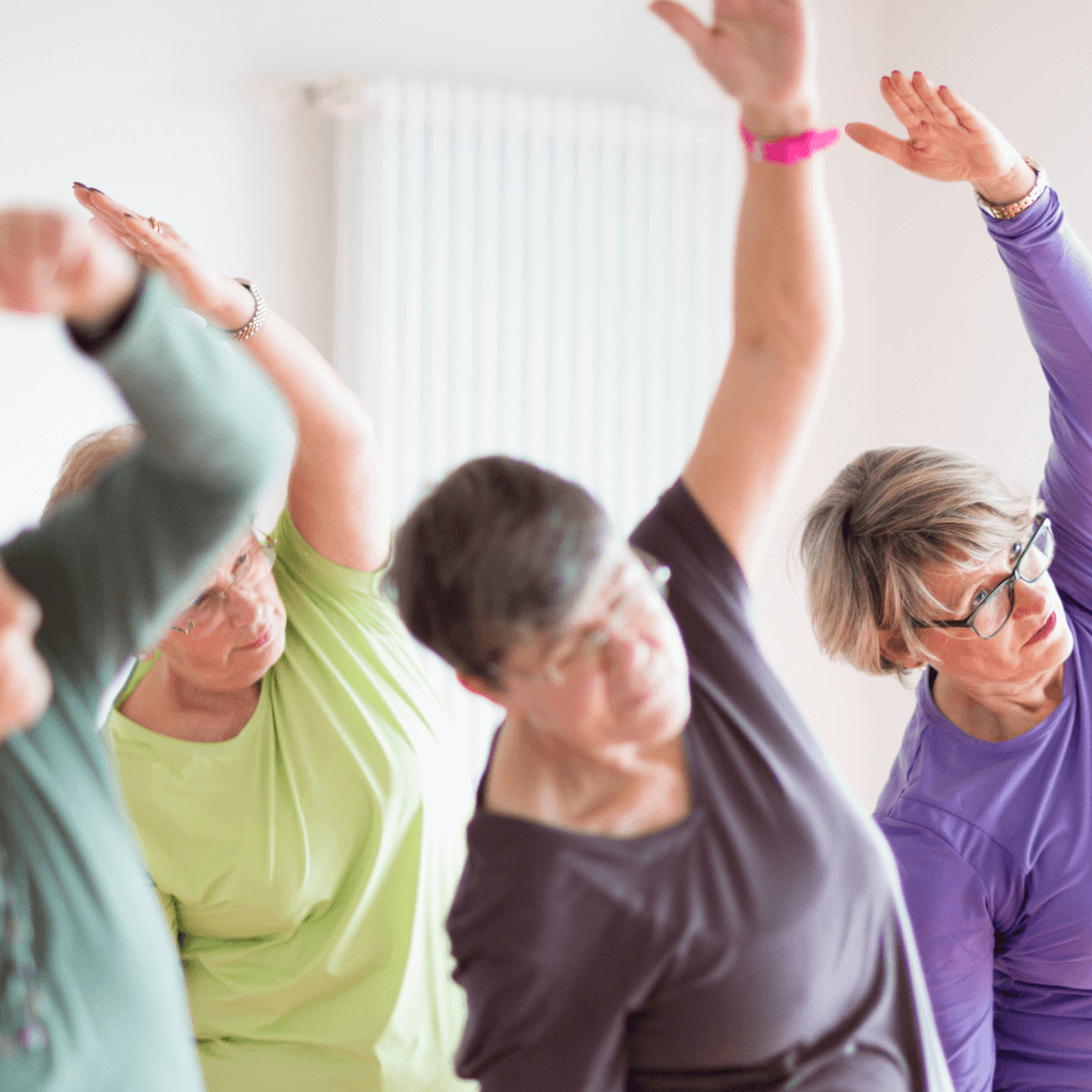 seniors doing a side stretch exercise